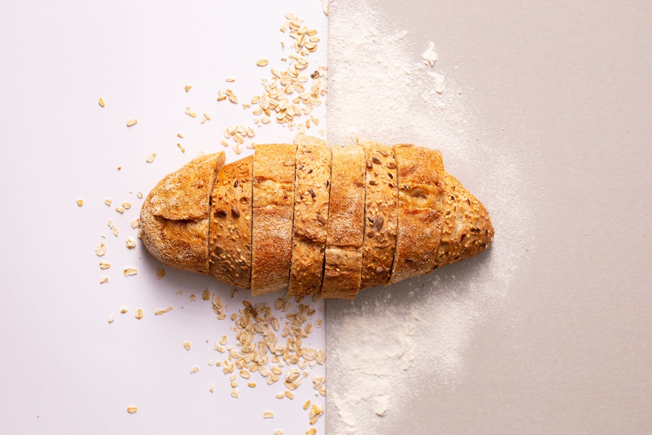 Home Freshly sliced whole grain bread with oats and flour provides a rustic and nutritious appeal.